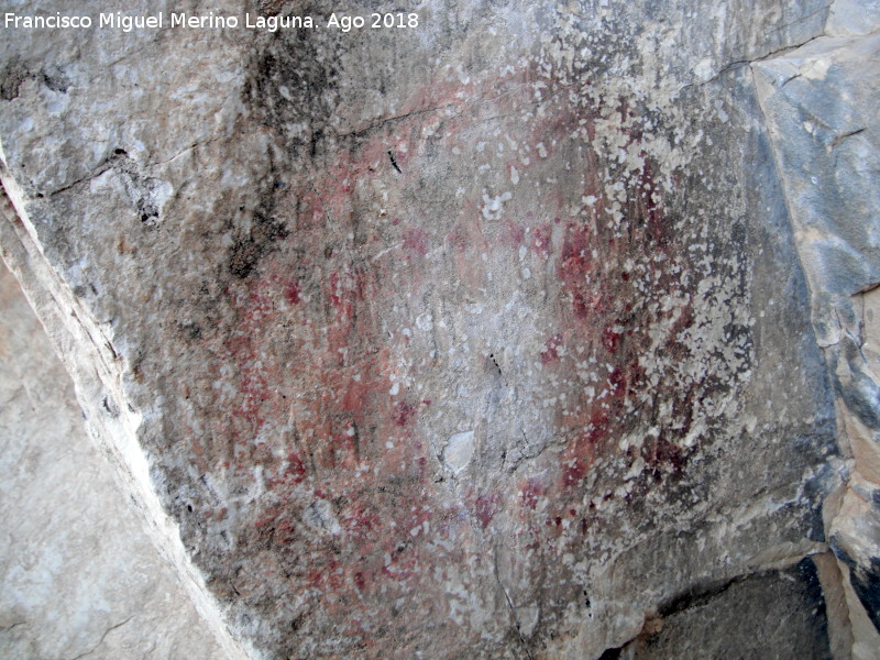 Pinturas rupestres de la Raspa de Piedra Redonda III - Pinturas rupestres de la Raspa de Piedra Redonda III. Figura hecha con digitaciones de la pared izquierda